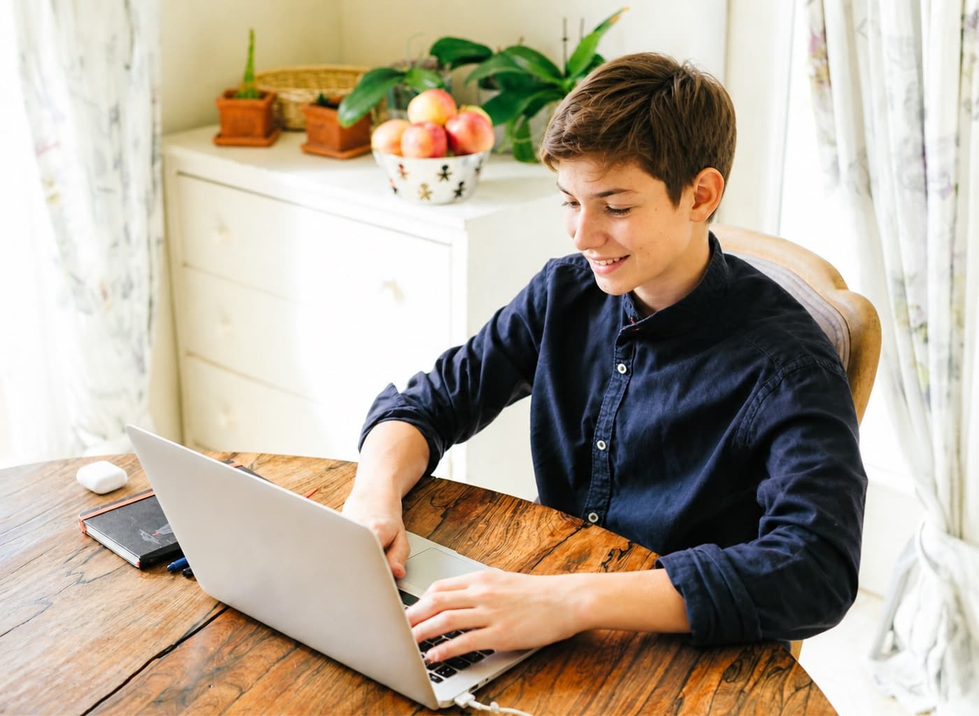 High school student smiling during an online tutoring session